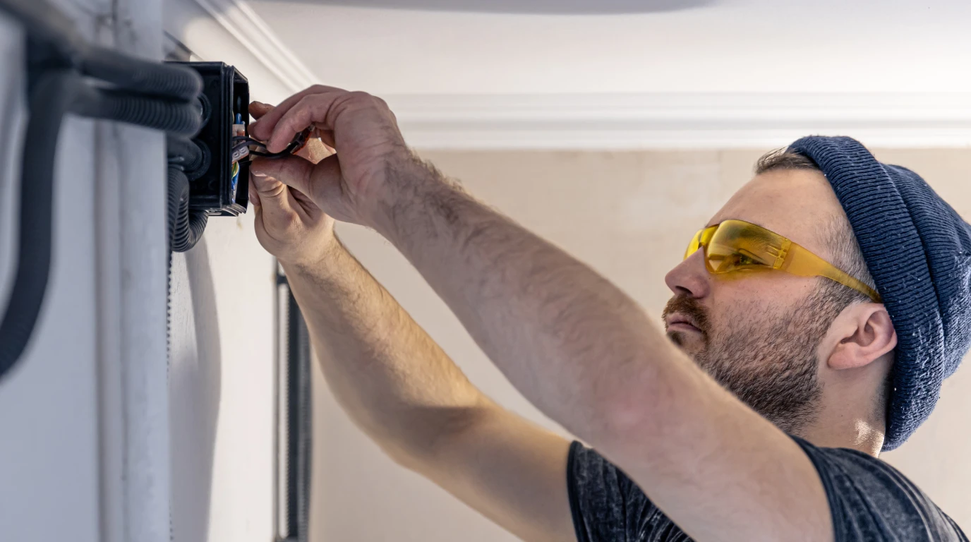 Garage door repair technician on the job